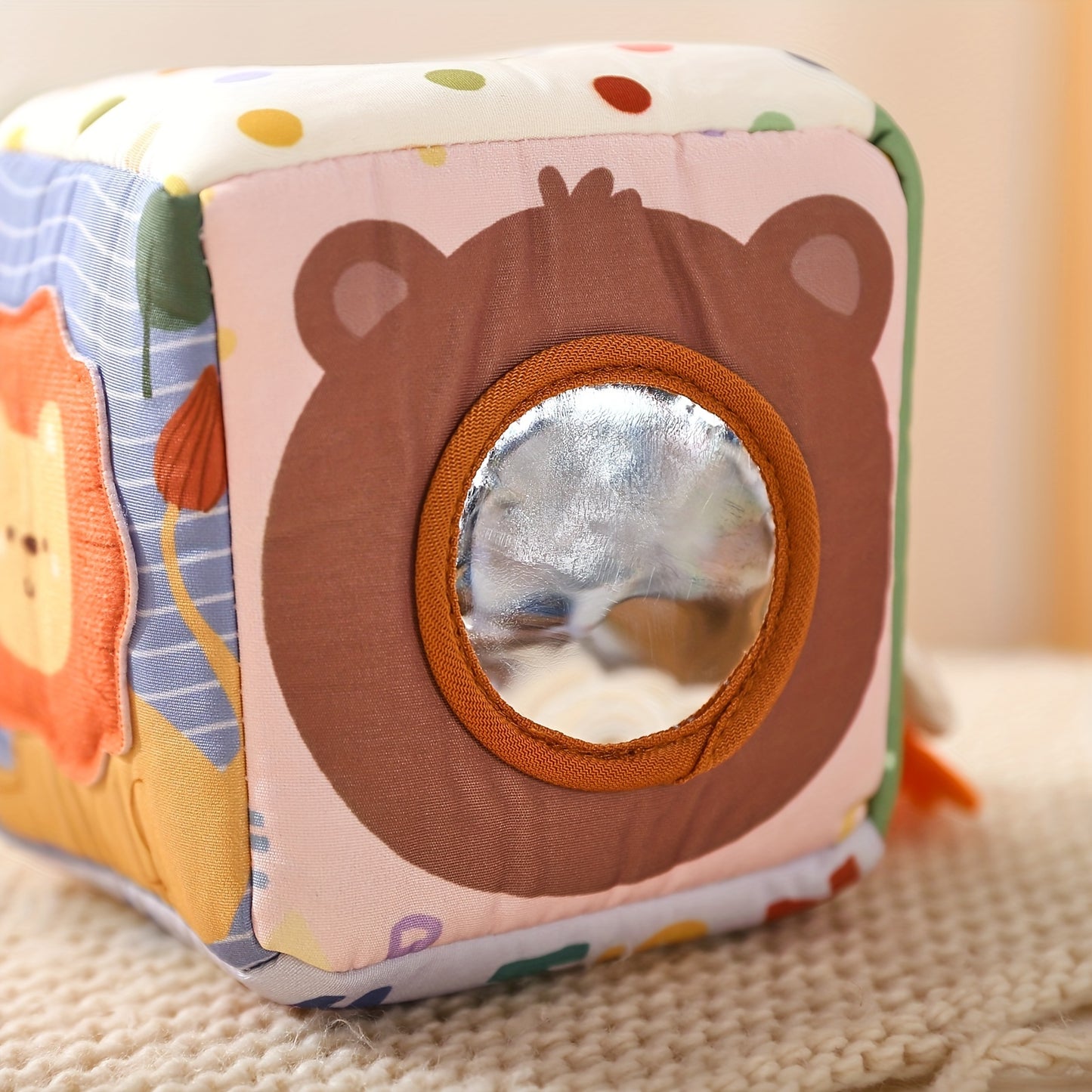 Interactive tissue play box with bright tissues to help babies develop fine motor skills and sensory awareness.