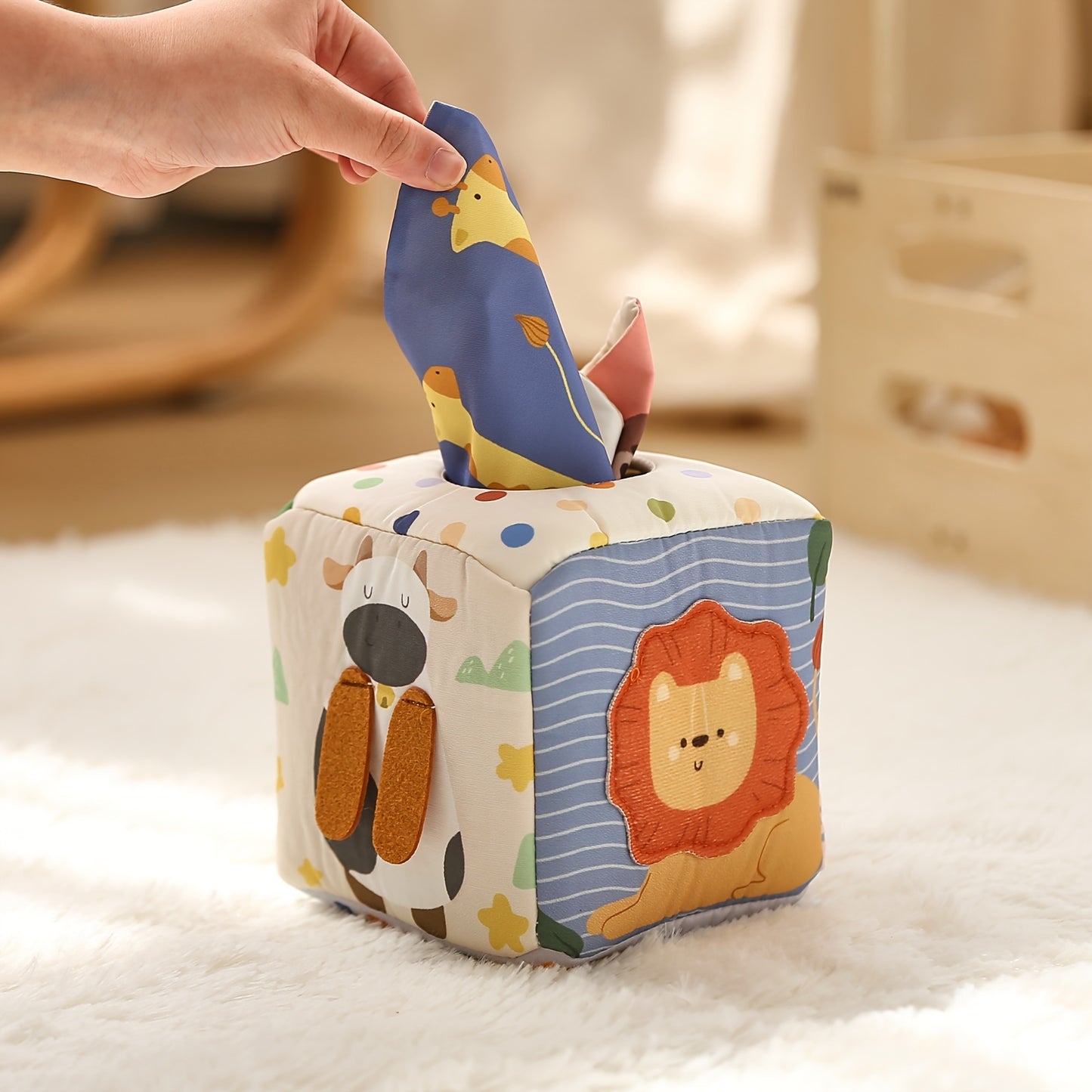 Baby sensory toy featuring a tissue play box with vibrant soft tissues to enhance tactile learning and hand dexterity.