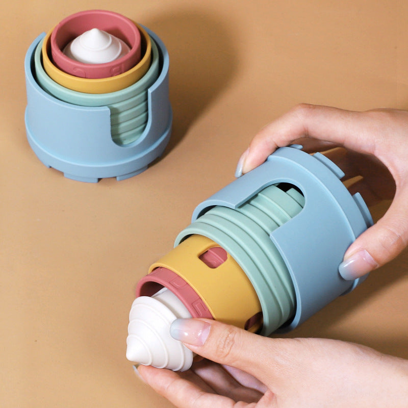 Close-up of silicone blocks being sorted by a toddler for tactile learning.
