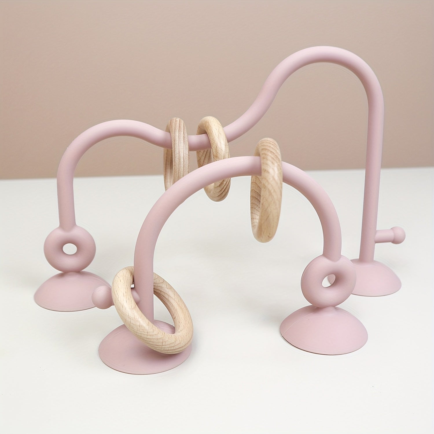 Soft pink silicone baby maze toy for tactile sensory and fine motor play