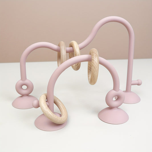 Soft pink silicone baby maze toy for tactile sensory and fine motor play