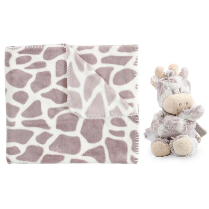 Giraffe-patterned blanket and stuffed giraffe toy on a white background