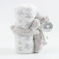 Elephant plush toy with a label on a white background
