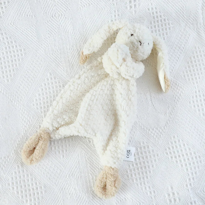 White plush bunny toy on a textured white surface