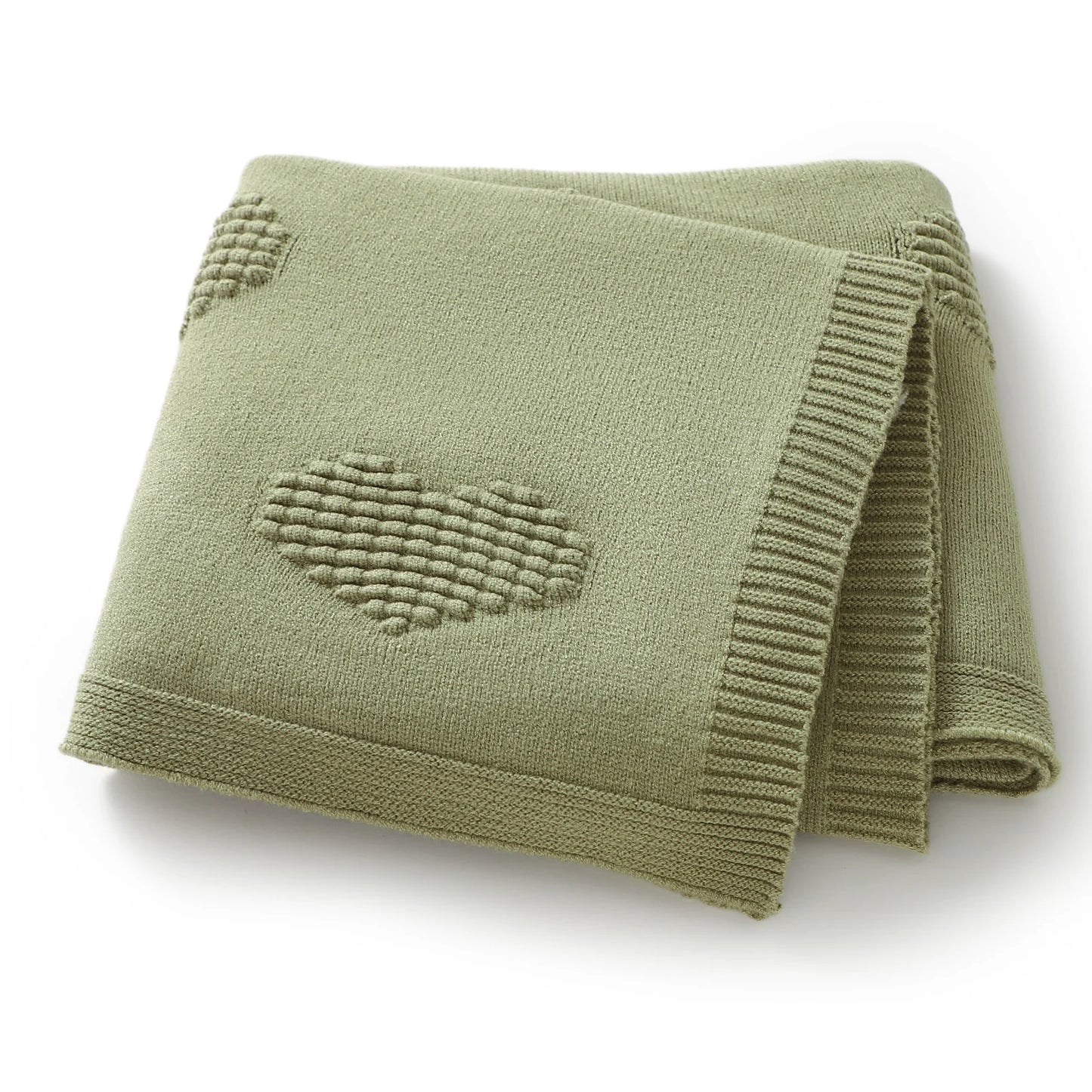 Folded green blanket with a heart pattern on a white background