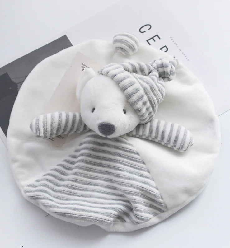 White baby blanket with a gray teddy bear toy on a white background