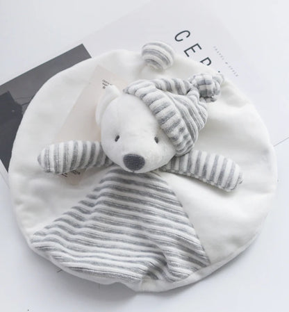 White baby blanket with a gray teddy bear toy on a white background