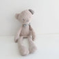 Stuffed teddy bear with a bow tie on a white background