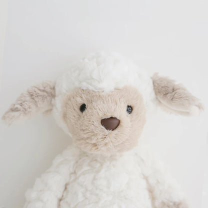 Plush teddy bear with a neutral expression on a light background