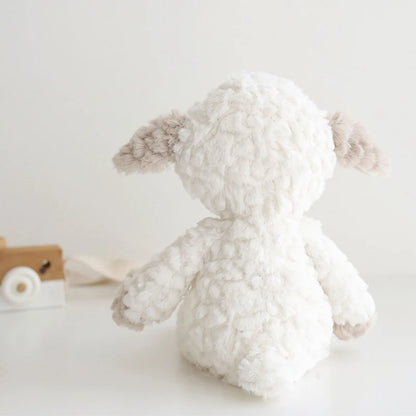 White plush toy with brown accents on a light gray background