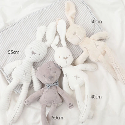 Plush toys with size measurements on a soft fabric background