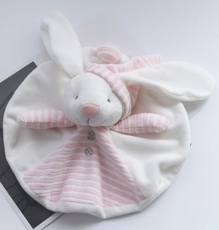 White baby hat with pink bunny ears and bow on a light gray background