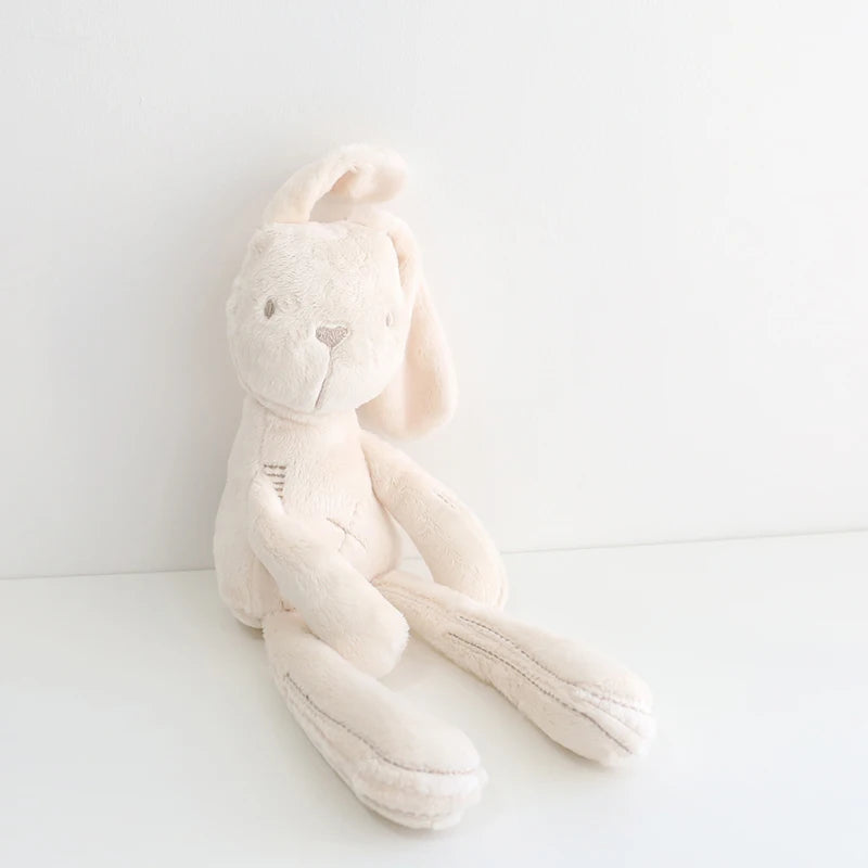 White plush bunny toy on a white background