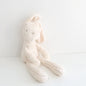 White plush bunny toy on a white background