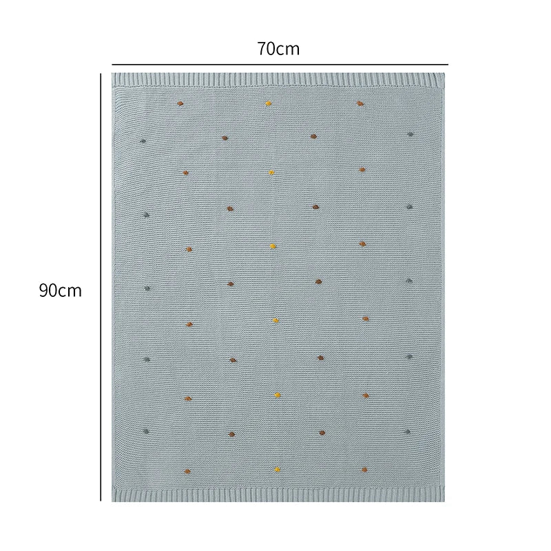 Blue blanket with small brown and yellow dots, shown with dimensions 70cm x 90cm on a white background.