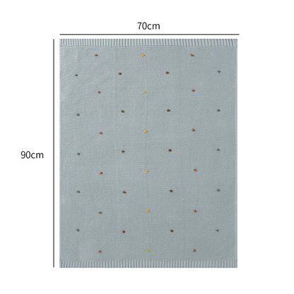 Blue blanket with small brown and yellow dots, shown with dimensions 70cm x 90cm on a white background.