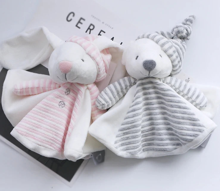 Two plush toys, one pink and one gray, on a white surface.