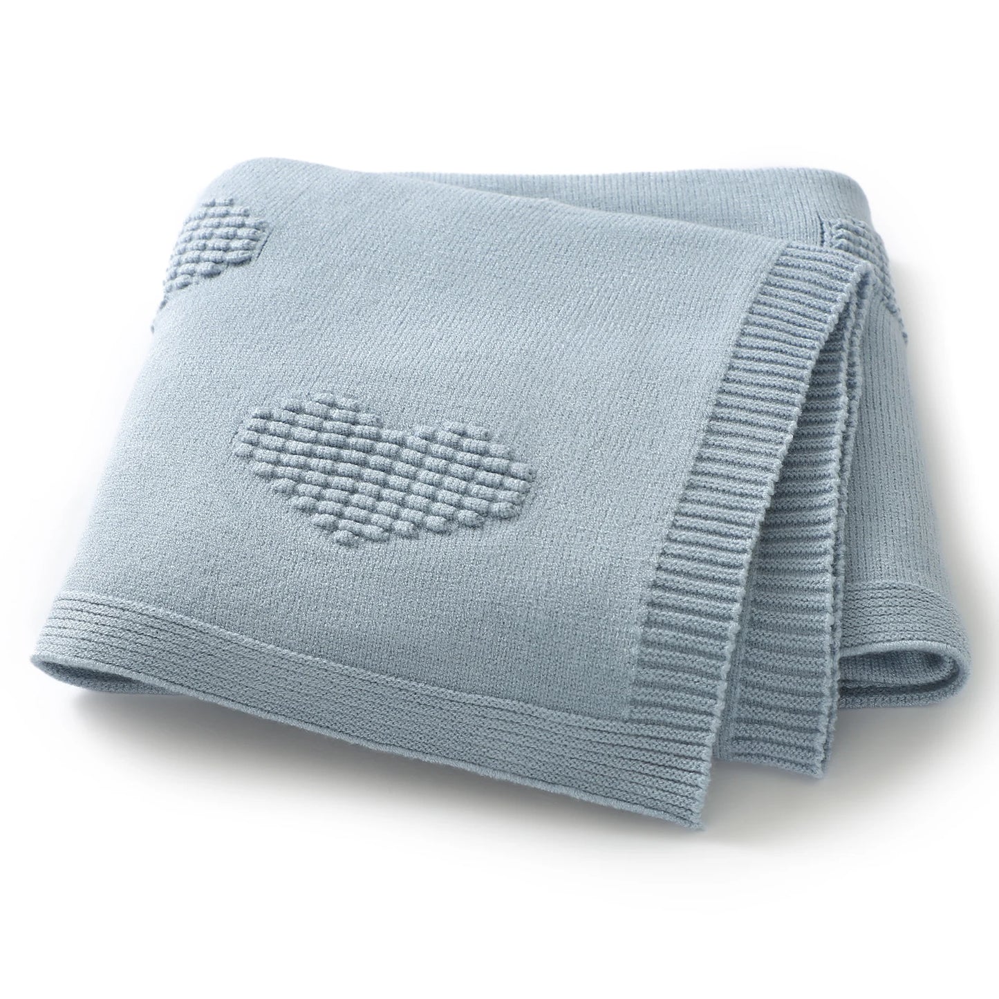 Folded light blue blanket with a heart design on a white background
