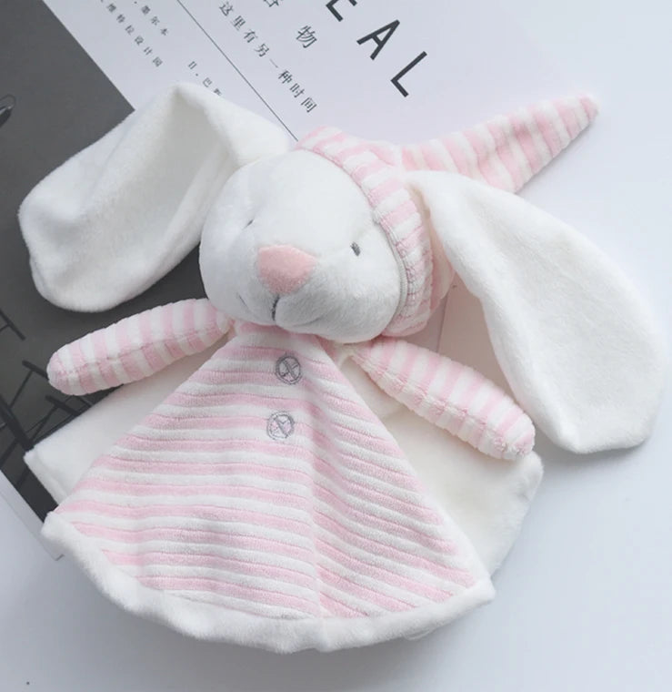 Plush toy rabbit in a pink and white outfit on a light background