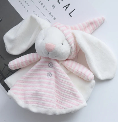 Plush toy rabbit in a pink and white outfit on a light background
