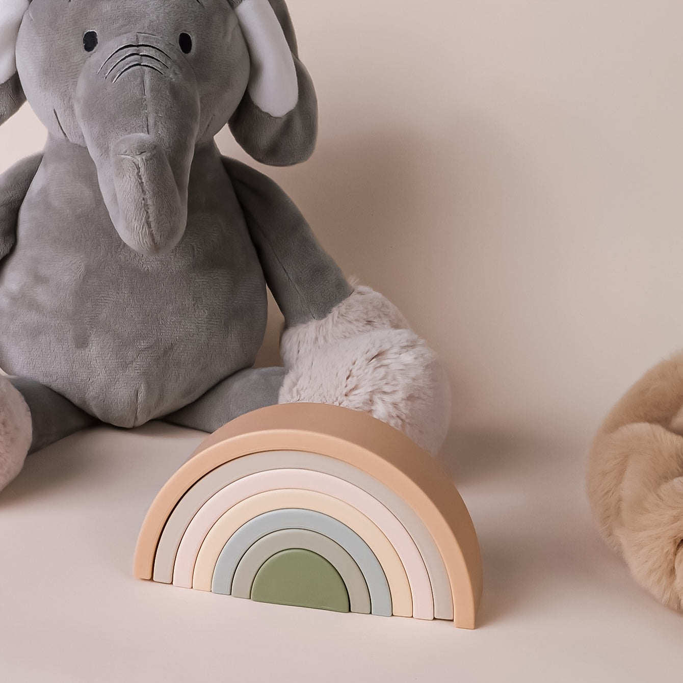 Close-up of macaron pastel silicone arches stacked for developmental play