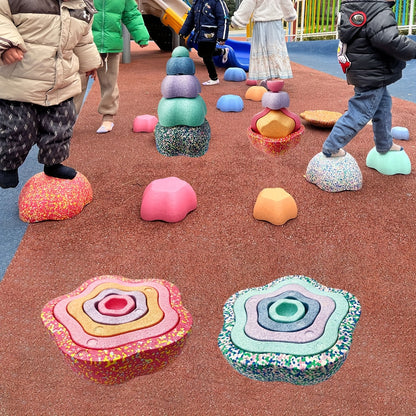 Soft pink tone stones on grass during outdoor exploration