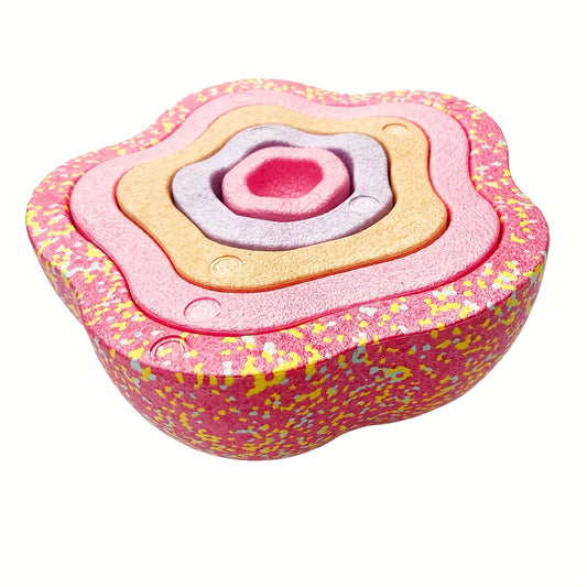 Pink stacking stones arranged from largest to smallest