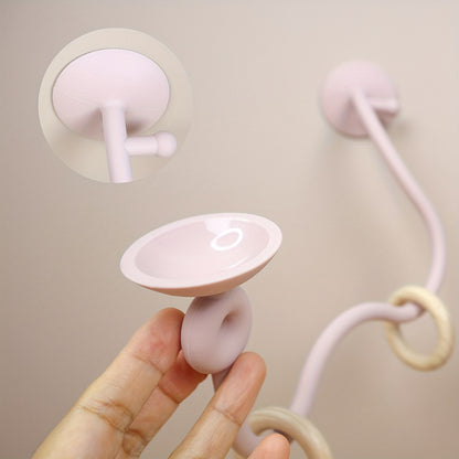 Suction-based soft pink maze toy promoting baby’s brain and motor development