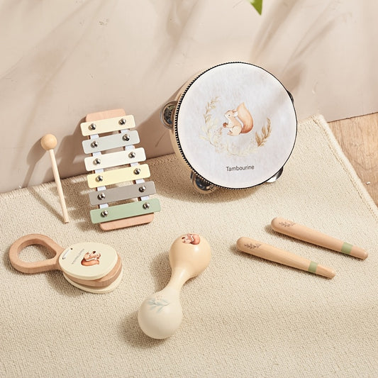 Small musical instrument set for toddlers with shakers, bells, and tambourine.