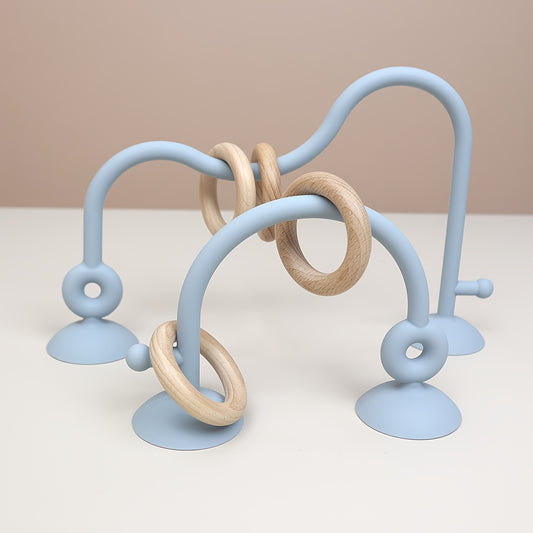 Blue silicone baby maze toy with suction base for fine motor and sensory development
