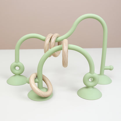 Montessori-inspired mint green maze toy with suction for hands-on baby play