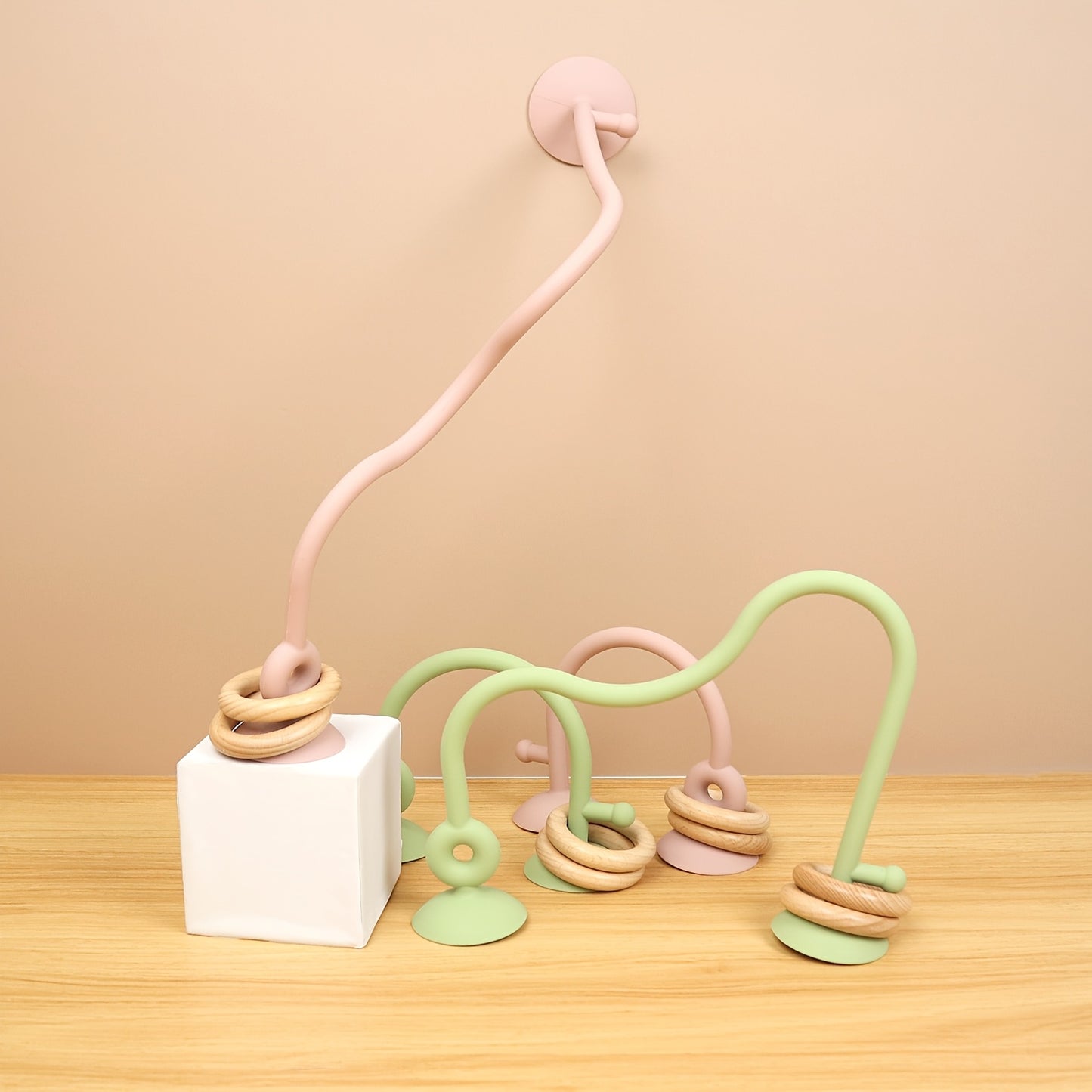 Cognitive development toy for infants featuring a maze and colorful silicone beads