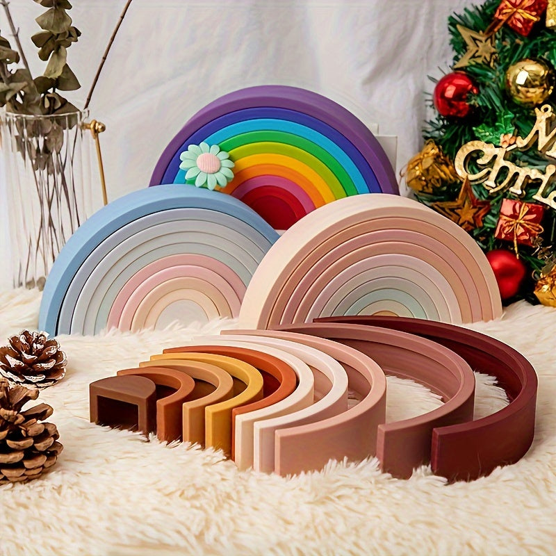 Wooden stacking rainbow toy with colorful arches arranged in a tower.