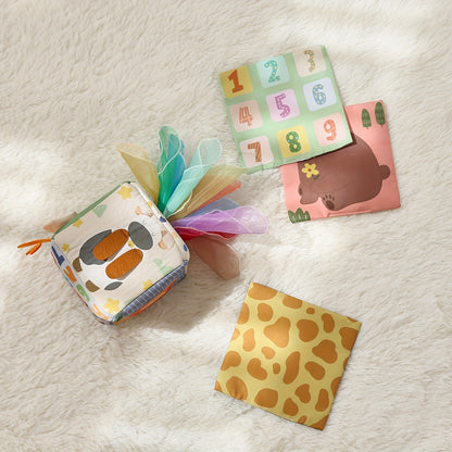 Bright tissue play box toy with soft tissues to support sensory development and hand coordination in babies.